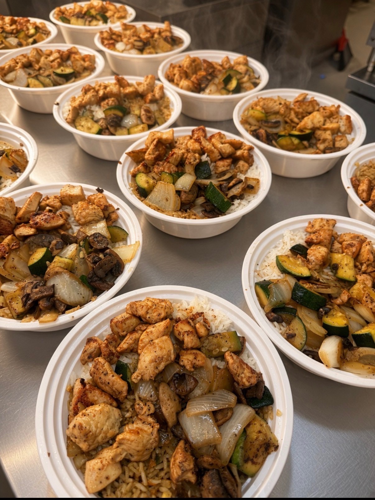 Fresh hibachi bowls with grilled chicken, rice and vegetables