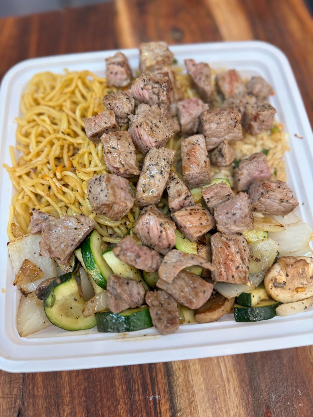 Steak with garlic noodles and hibachi vegetables